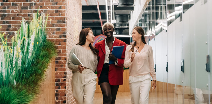 three women walking down the hallway