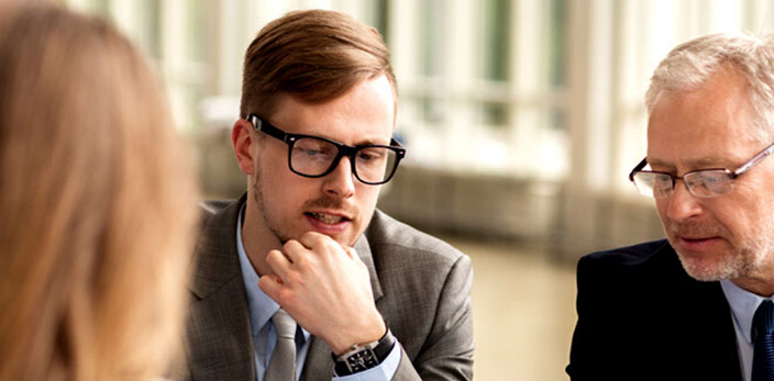 man thinking of what to say in a meeting