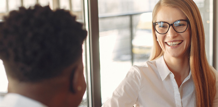 woman speaking to a man, interview