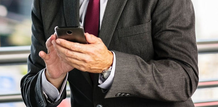 close up shot of man using his phone