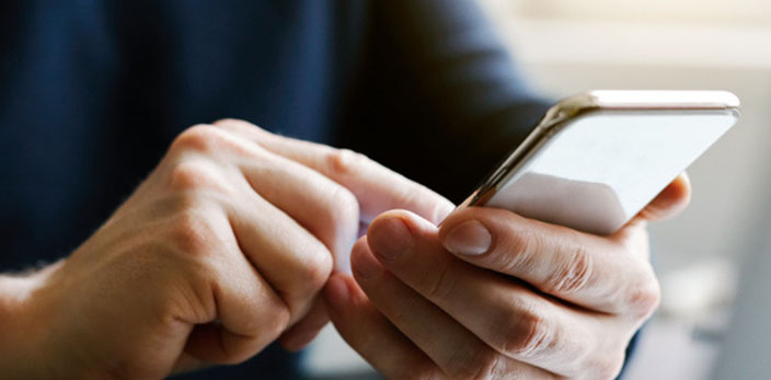 man on phone, tapping the screen