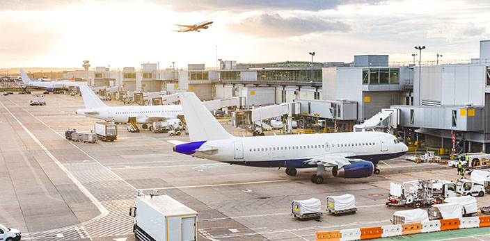 Macro view of an airport full of planes standing by