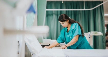 Healthcare-frontline-upskilling_422-x-221 healthcare worker fixing hospital bed